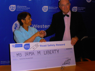 Minister Carlisle and Ms Irma Liberty the winner of the R25 000 Reward