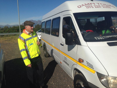 Minister Robin Carlisle interacting with motorists at the launch of the Easter Operational Plan. 