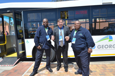 Minister Donald Grant with Go George bus drivers Andile Zitha and Prins Swartz.