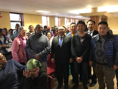 Minister Fritz with elderly residents and Chinese business owners