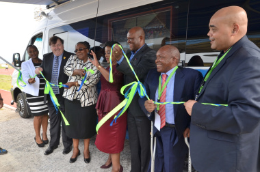 Minister Grant, Minister Peters and Deputy Minister Chikunga officially cutting the ribbon for the new RAF mobile office.