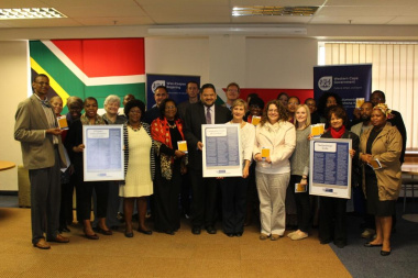 Minister Marais and Brent Walters with the members of the Western Cape Provincial Language Forum with the Language Code of Conduct