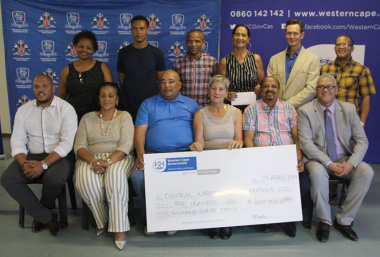 Minister Anroux Marais and Dr Lyndon Bouah with the recipients of sport funding in the Central Karoo