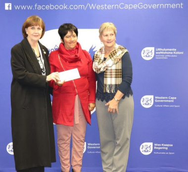 Minister Anroux Marais hands over sport funding to Ald Elize Steyn and Cllr Sucilla van Tura of Saldanha Bay Municipality