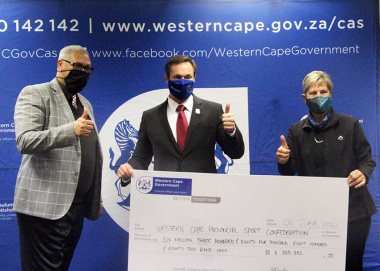 Minister Marais, with Chief Director Dr Lyndon Bouah hands over funding to WCPSC President JP Naude