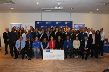 Minister Marais with other DCAS officials and the recipients of the cheque of R3 019 000