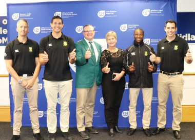 Minister Marais with some of the SA Ice Hockey Players and their coach, Johan Sundin and team manager Ben Denysschen.
