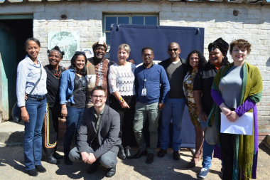 Minister Anroux Marais with staff members from HWC and Museum Service who worked on the project