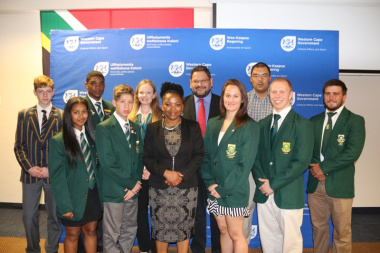 Minister Mbombo and HOD Walters with some of the athletes who were honoured