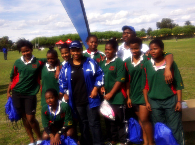 Minister Mbombo with the Busy Bees U18 team.