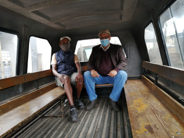 Minister Meyer and agri-worker George Hugo inside the smaller vehicle fitted with seats on the Applewaite farm in Elgin