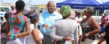 Minister of Community Safety, Dan Plato engages a group of women from Marikana informal settlement who attended the 16 days of Activism Launch.