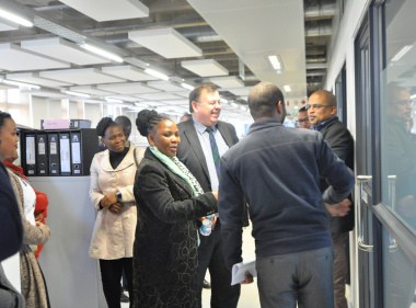 Ministers Donald Grant and Dr Nomafrench Mbombo interact with staff members.