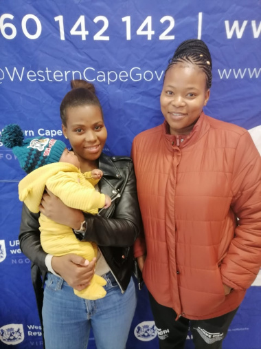 Mom Asiphe Kona with Baby Oluhle and her sister Yonelisa Ngomani attended the event to share her thanks for the excellent service at the Du Noon MOU.