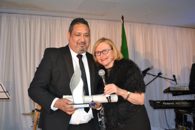 Mr Shaun Julie receives his award from Premier Helen Zille