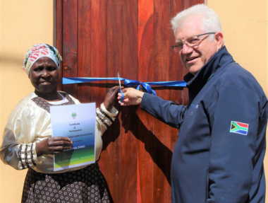 Ms Albertina Zono receives her home from Premier Alan Winde