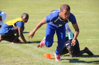 Nande Mhlomi from Mbekweni in hot pursuit in a game of Kho-Kho at the Cape Winelands Indigenous Games .