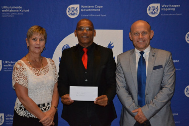 Overberg Sport Council Chairperson Rudolph Johannes received their cheque from Minister Anroux Marais