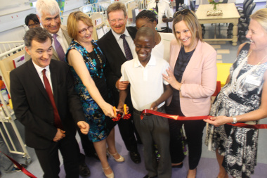 Victoria Hospital Paediatric Ward patient, Christopher, opens the revamped ward with Premier Helen Zille, Minister Theuns Botha and other dignitaries.
