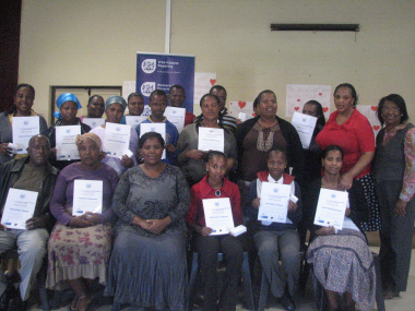 Parents and community members who received certificates with facilitators, teachers and DCAS staff.