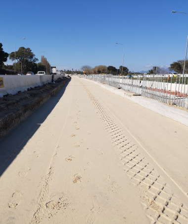 Phase 2 median widening and installation of the concrete median barrier.