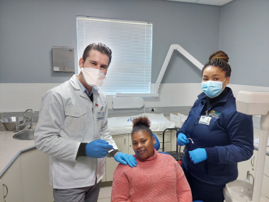 Shirmone Kriga knows that oral health is important. With her is Dr Julien Joubert and dental assistant Siya Sishuba at her appointment.