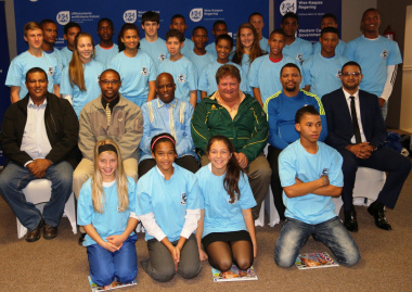 Representatives of DCAS, the West Coast Sport Council and the academy pose with athletes.