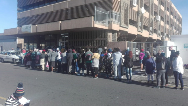 Temporary Disability Grants (TDGs) and Care Dependency Grants recipients queuing outside the SASSA offices 