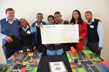 Minister Grant congratulates Parkdene Secondary School learners, the winners of the PET competition.