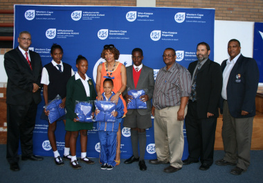 Some of the athletes who received Ministerial Bursaries pose with dignataries.