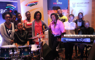 The group of musicians from Langa High School with arts and culture teacher Ms Nombulelo Ndlovu (left).