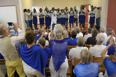 The Lwandle community choir entertaining their audience and their audience enthusiastically participating