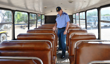 Traffic Inspector Jacques Mostert inspects the seats of a bus.