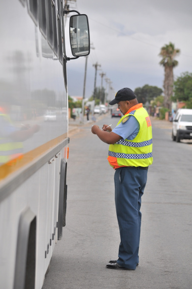 Traffic officer Jerome Kriel inspects a bus.