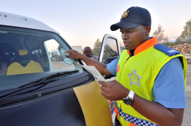 Traffic Officer Nonwabisi Soswana inspects a minibus taxi for roadworthiness.