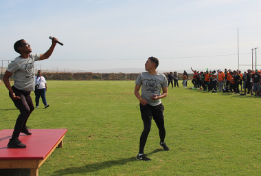 Two SANDF members lead the participants through an aerobics session before the start of competition.