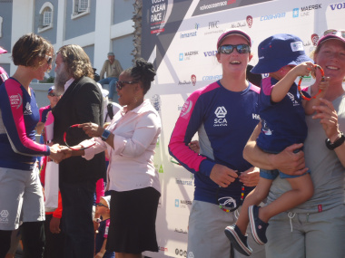 Cultural Affairs and Sport Minister Nomafrench Mbombo hands over proudly South African gifts Team SCA on arrival.