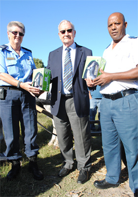 Minister Van Rensburg flanked by Diana Truter and Clive Matthews.