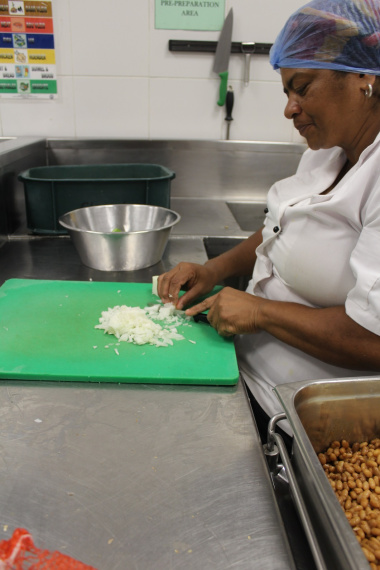 A food services staff member prepares a meal at Red Cross War Memorial Children’s Hospital.