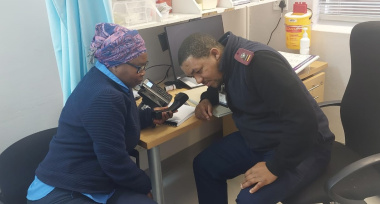 Plettenberg Bay Clinic – Nurse Alfonso Swarts with patient Lungi Nkunge making use of the tele-interpreting service.