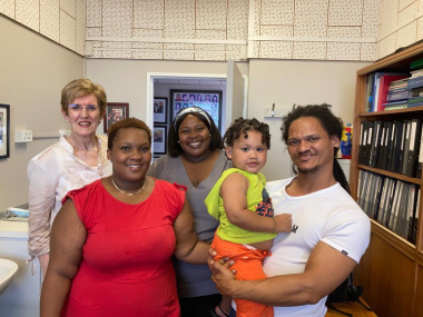 Zion and his parents together with Khanyisa Flente, who conducted the first hearing screening test, and Lida Muller, his audiologist at the Cochlear Implant Unit.