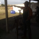 A competitor shoots at the target down range.