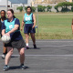 A netball player prepares to make a pass during one of the matches