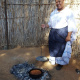 Audelia Chales demonstrating how pot bread is prepared