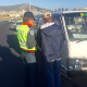 City of Cape Town traffic officer with driver of impounded vehicle.