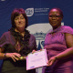 A representative from Hermanus Public Library receiving the award for Best Big Public Library from Nomaza Dingayo