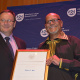 Minister Anton Bredell handing over a ministerial award to Elias P Nel