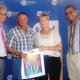 David Slinger (second from left) from Tankwa Karoo receiving his DVD from Minister Marais