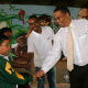 Dr Ivan Meyer and Kenny Solomon shake hands with Amagelo Manata and Ryan Daniels of Observatory Junior School.