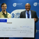 Michael Janse van Rensburg received the ceremonial cheque on behalf of Simon's Town Museum from Guy Redman